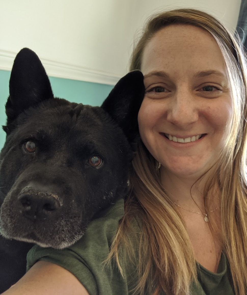 dog trainer anne baldwin smiling side by side black chow chow mix bear from barking bear petcare and training