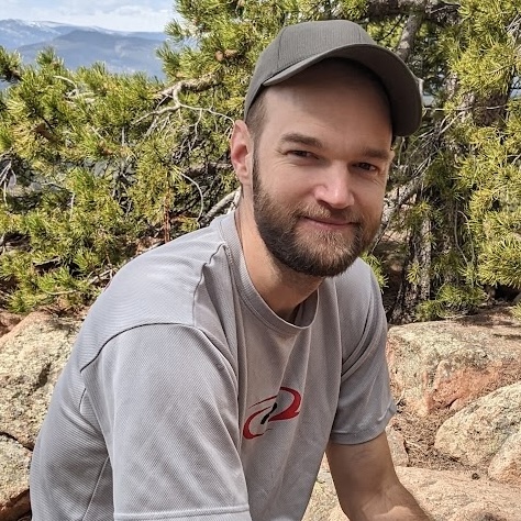 dan wiegand pet care provider smiling on a hike in the mountains